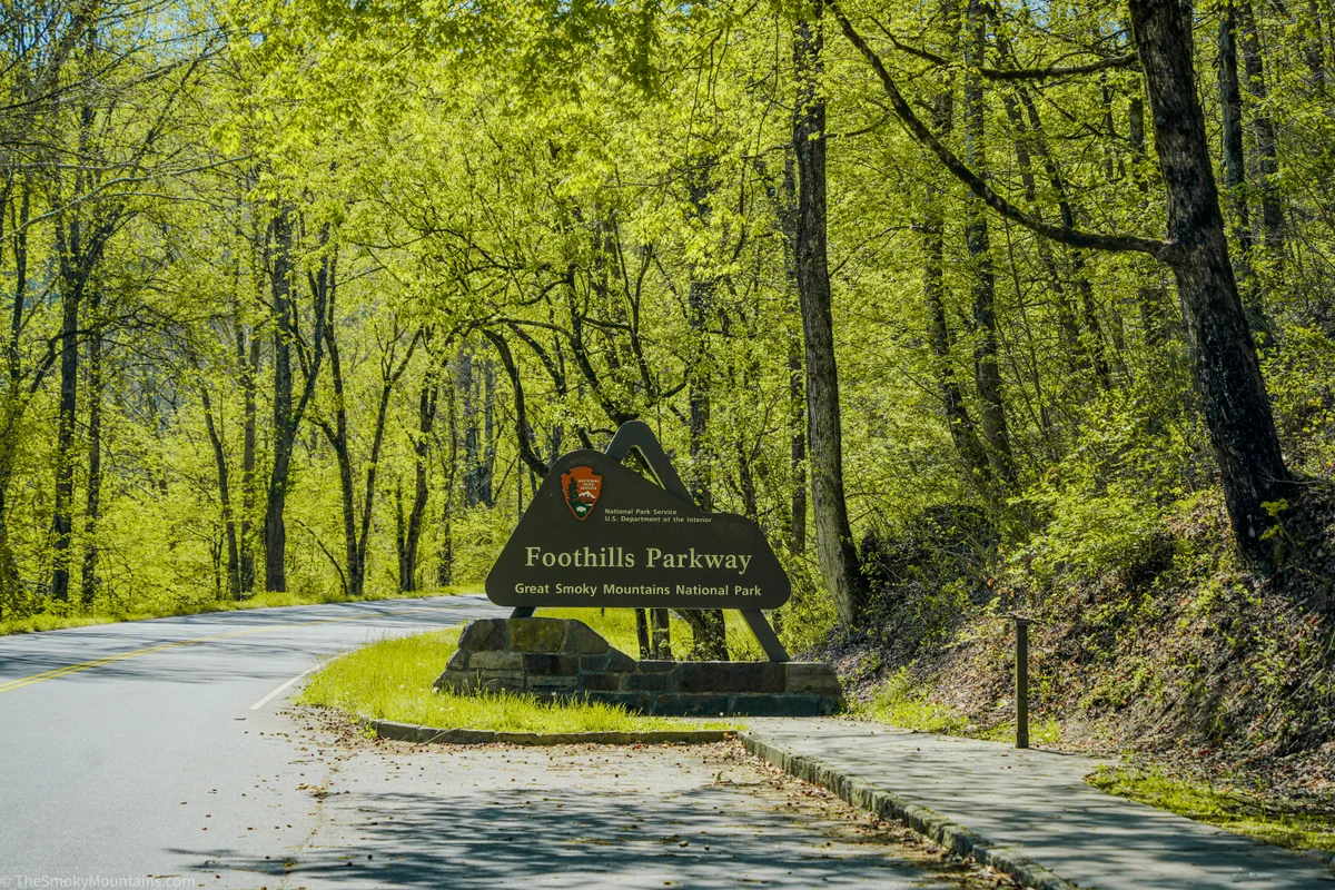 Foothills Parkway roadside sign beside a two-lane road
