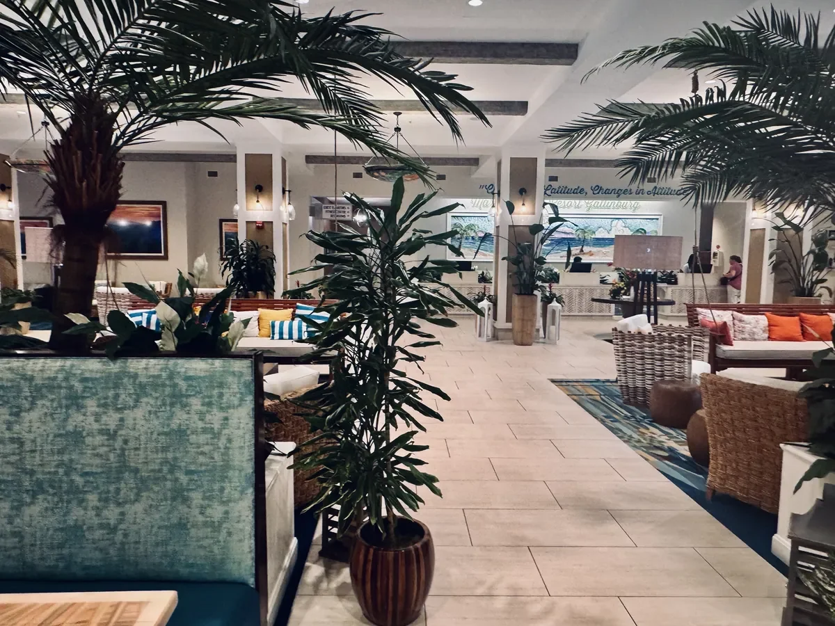 lobby view with tropical plants and island decor
