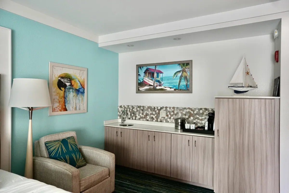 island decor hotel room with blue walls and a sailboat