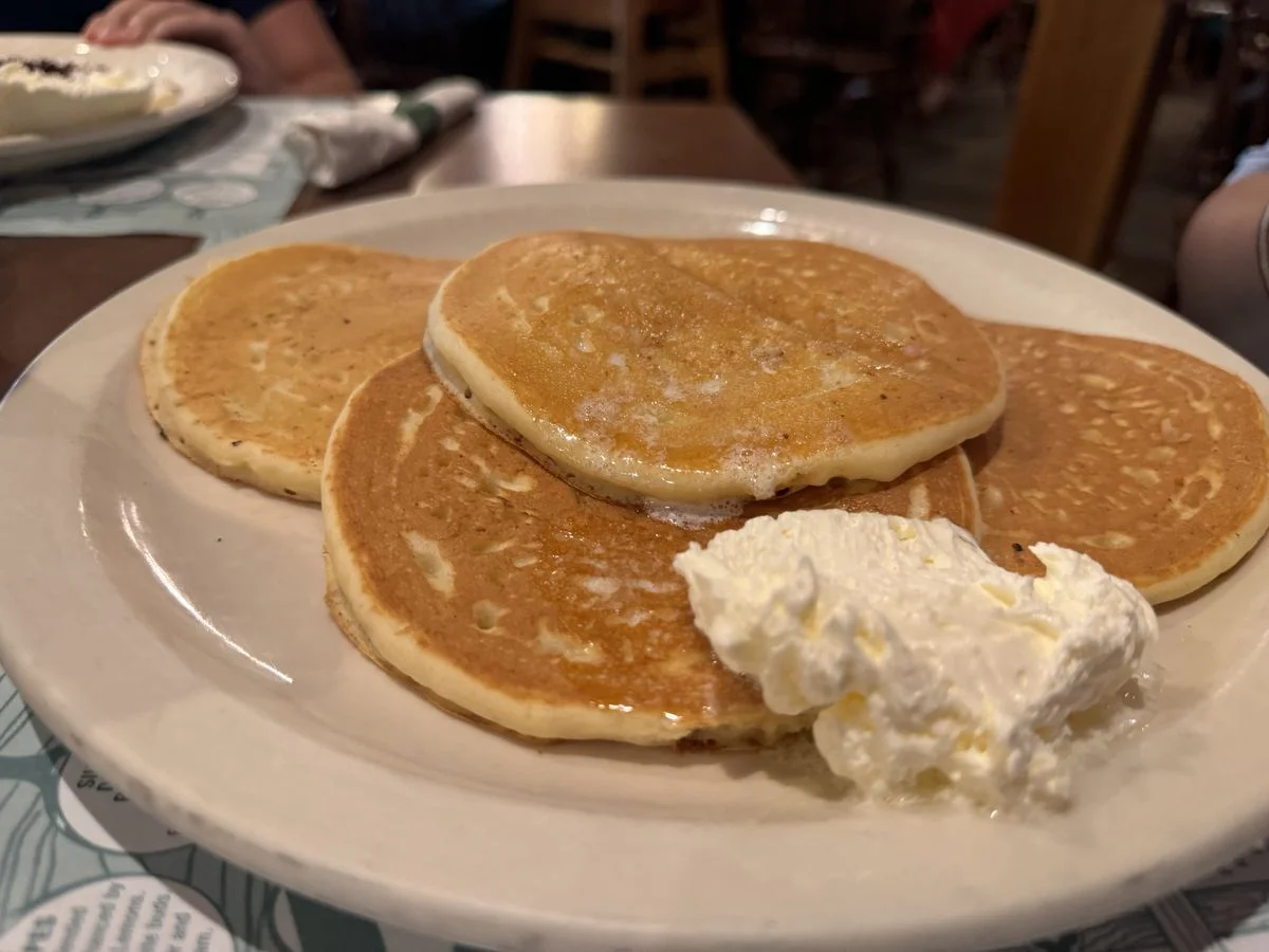 Plate of pancakes inside a restaurant