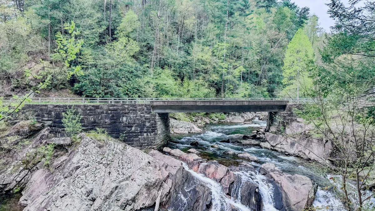 view of the sinks waterfall with road bridge going over the top