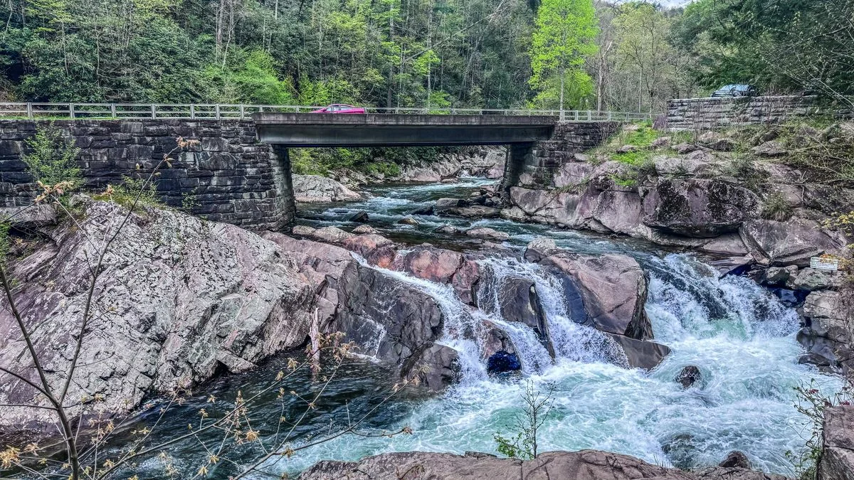 the sinks waterfall with road bridge going over the creek