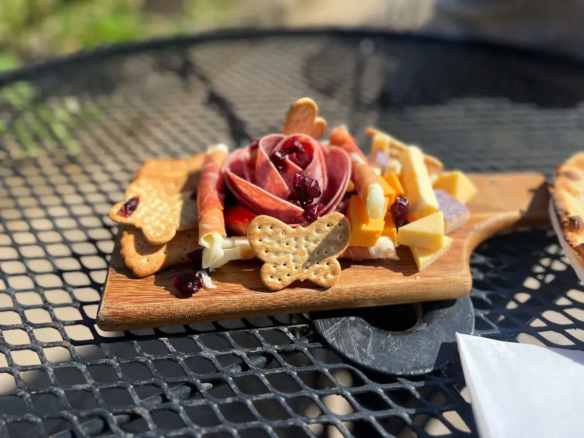 charcuterie board on outdoor table