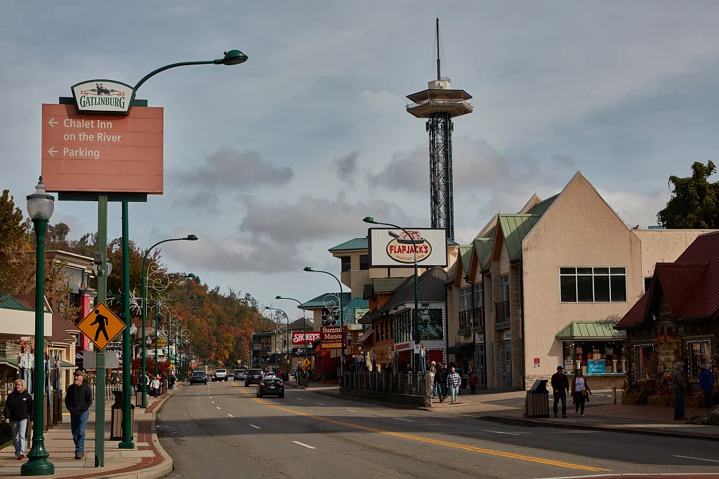 Downtown Gatlinburg street scene with the Space Needle visible above the buildings