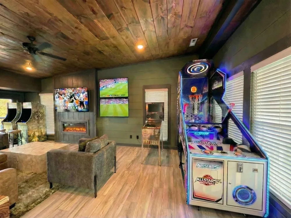 Game room with arcade and TVs