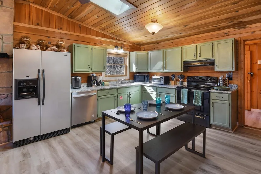 Cozy cabin kitchen with dining area