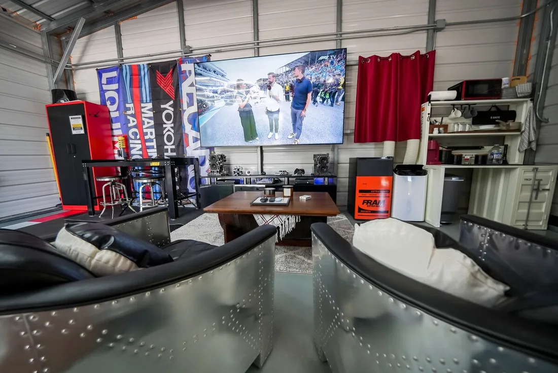 A lounge built around a big screen for race day and game day
