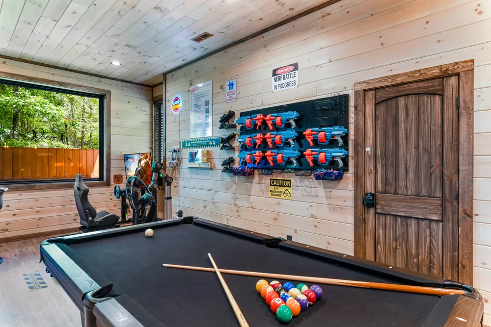 Game room with pool table and toys