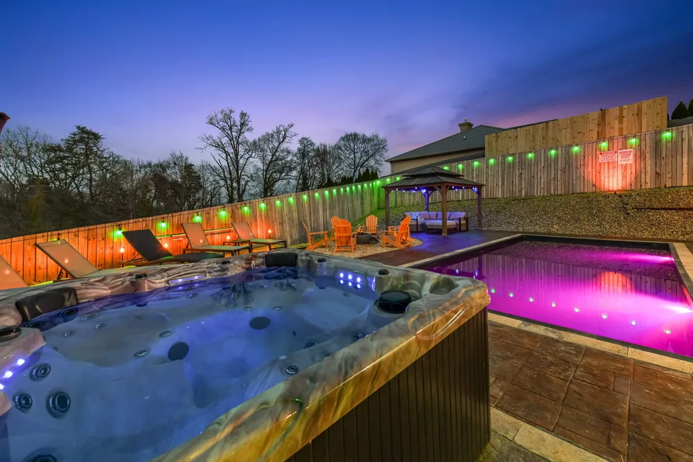 Hot tub and pool area at sunset