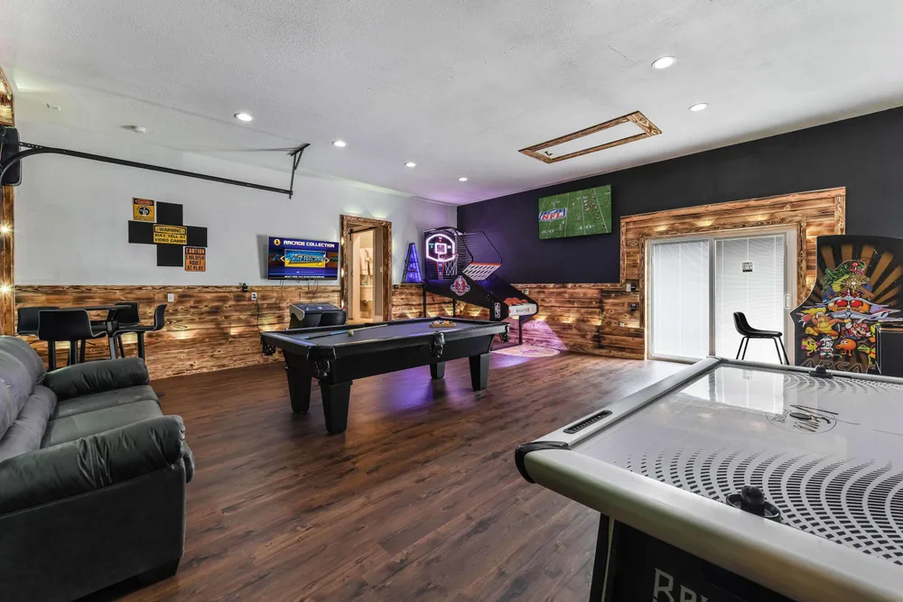 Game room with pool table and arcade