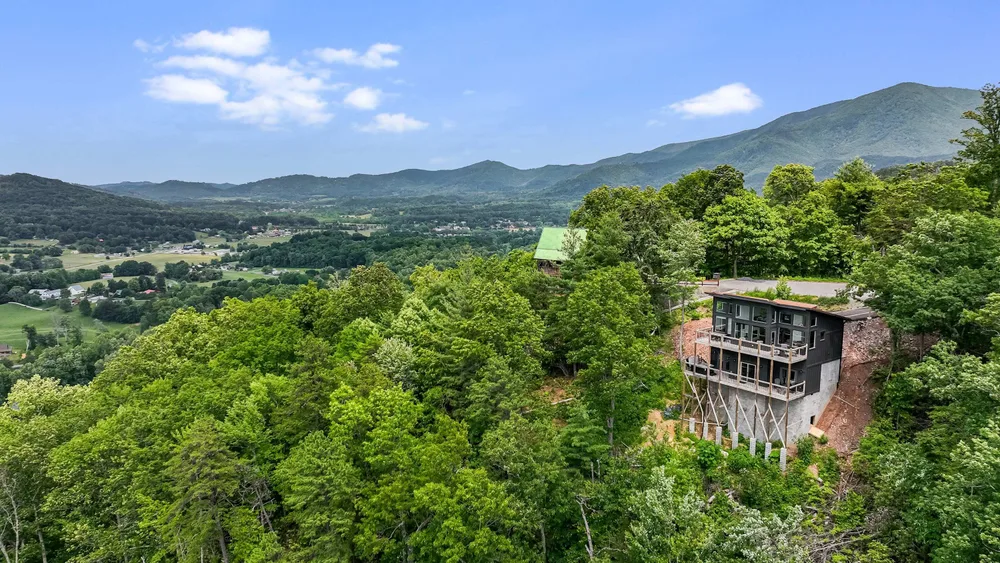 Modern cabin nestled in mountain landscape