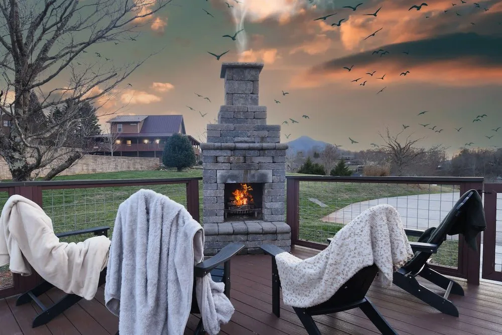Cozy outdoor seating with stone fireplace