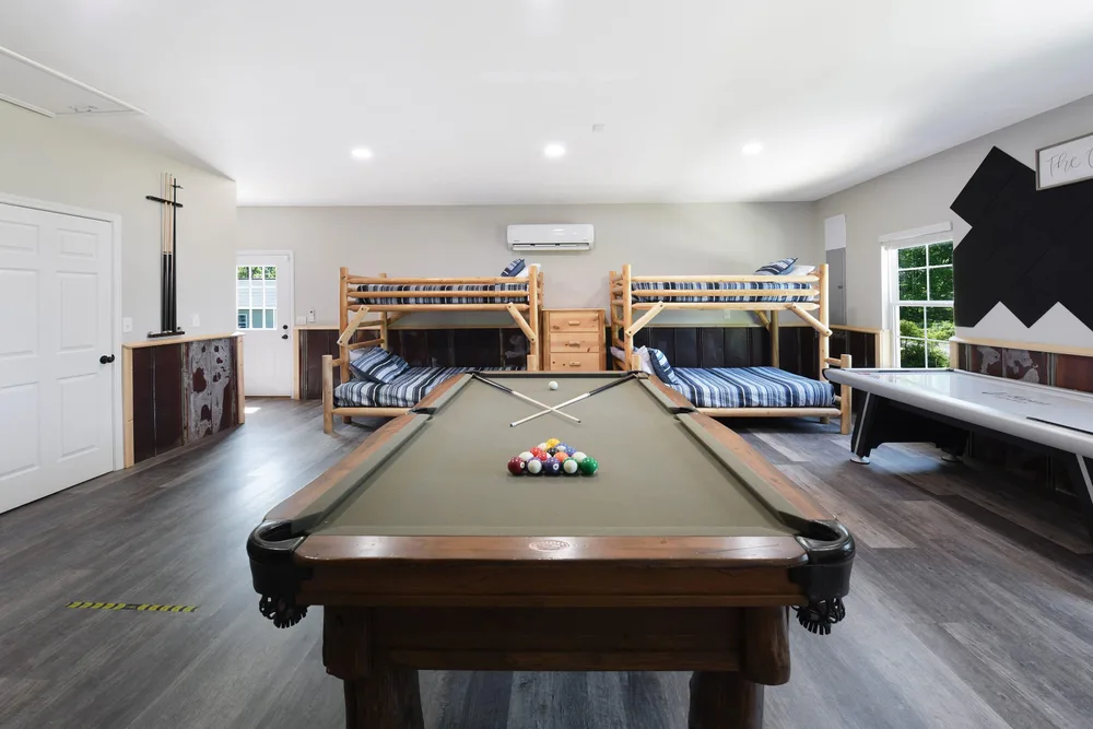 Game room with bunk beds and pool table