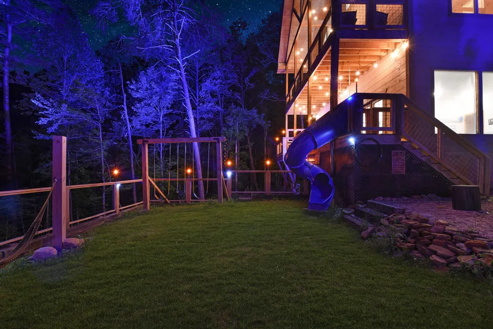 Backyard playground with slide and swing