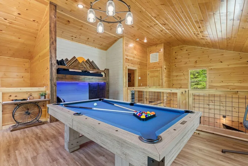 Game room with billiards table and seating