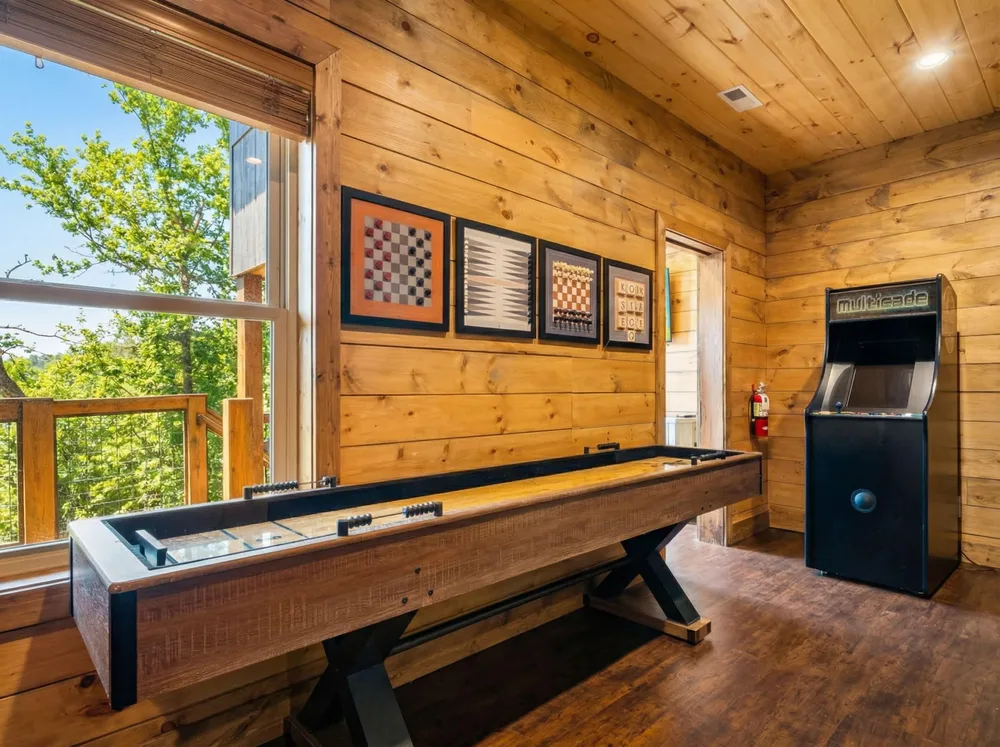 Game room with shuffleboard and arcade machine