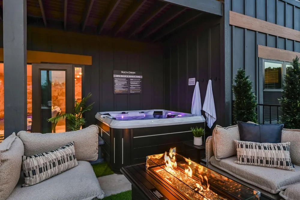 Outdoor hot tub with fire pit seating
