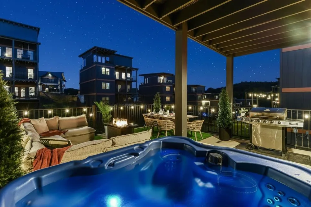 Hot tub on patio with city view
