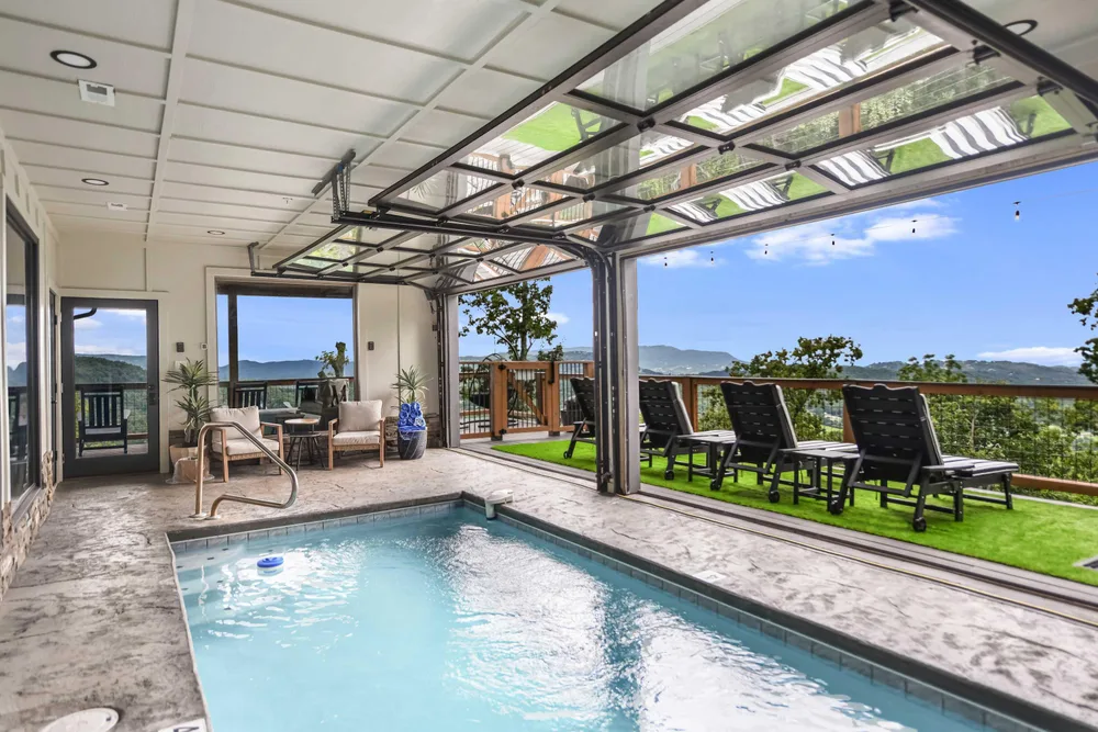Indoor pool with outdoor seating area