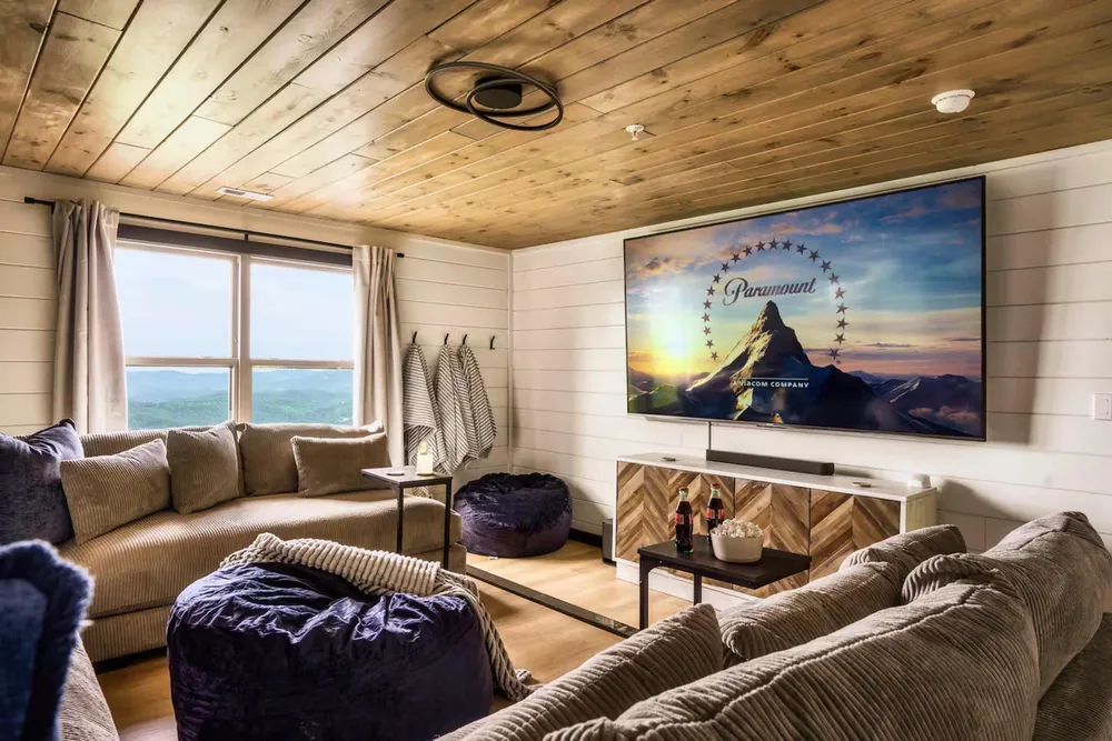 Cozy cabin living room with large TV