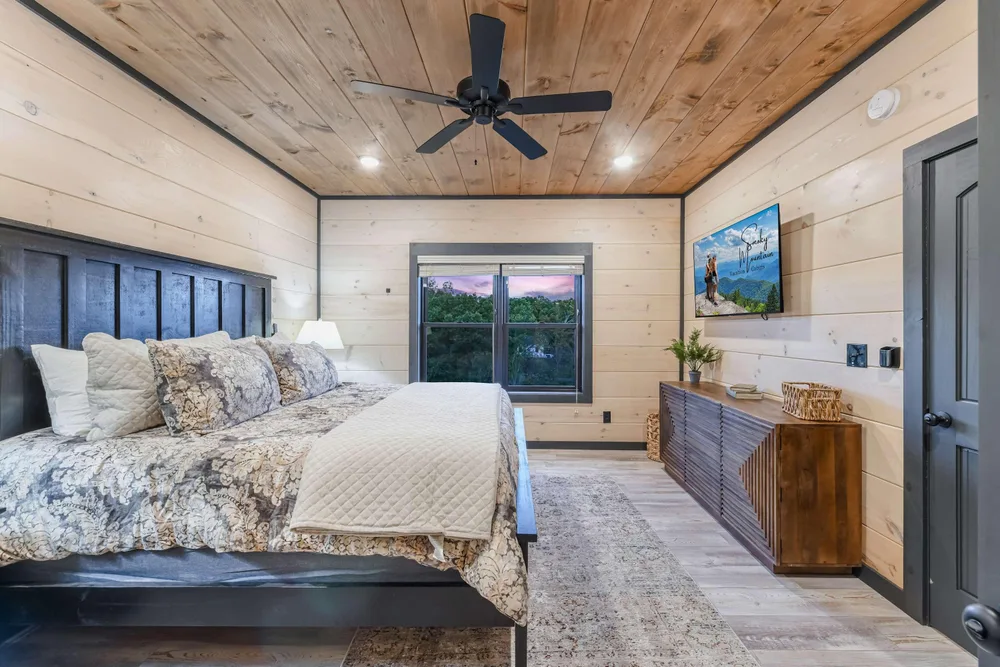 Cozy bedroom with wooden accents and view