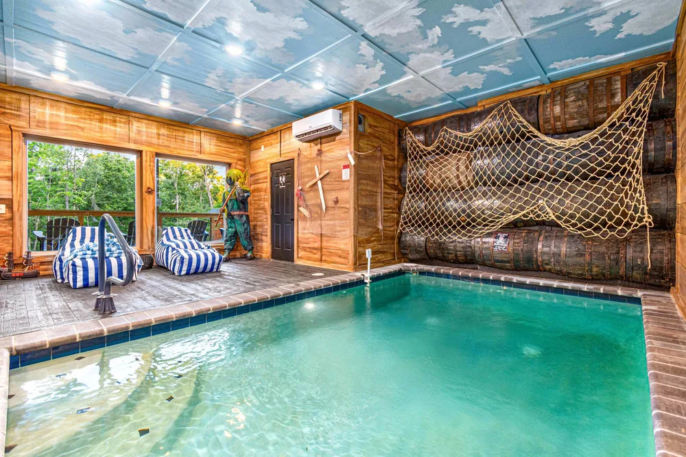 Indoor pool with nautical decor and seating