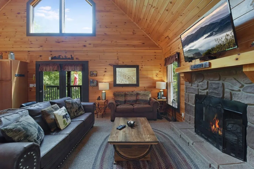 Cozy living area with stone fireplace