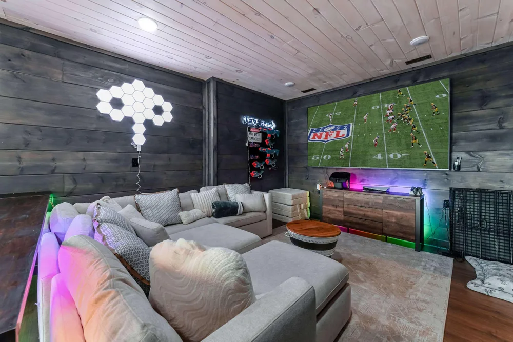 Cozy game room with NFL on screen