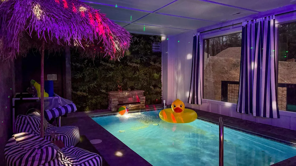 Indoor pool with seating and decor