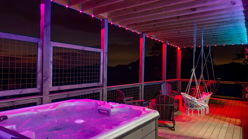 Hot tub on illuminated porch
