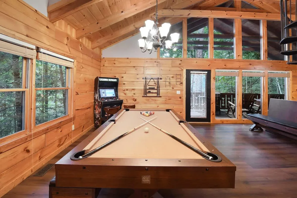 Game room with pool table and arcade