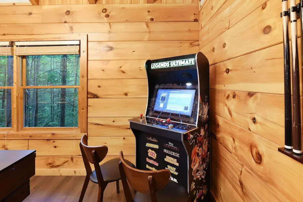 Arcade game setup in cozy cabin