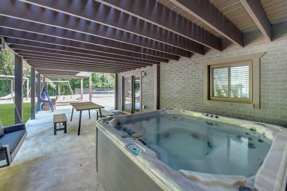 Hot tub under covered patio area