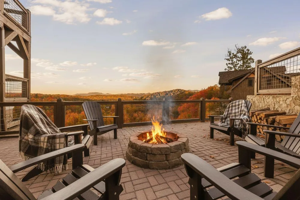 Fire pit surrounded by Adirondack chairs