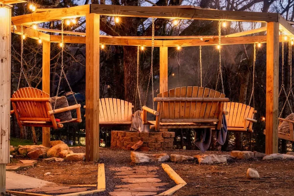 Swings under light canopy at cabin