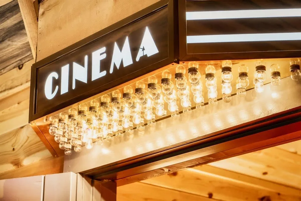 Cinema entrance with illuminated sign