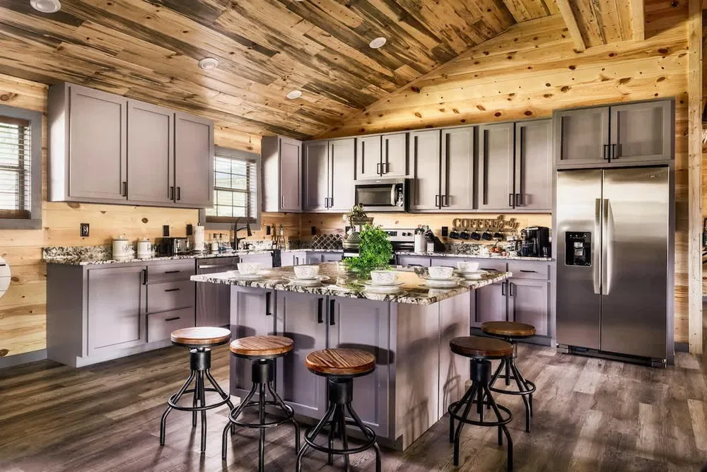 Modern kitchen with wooden ceiling and island