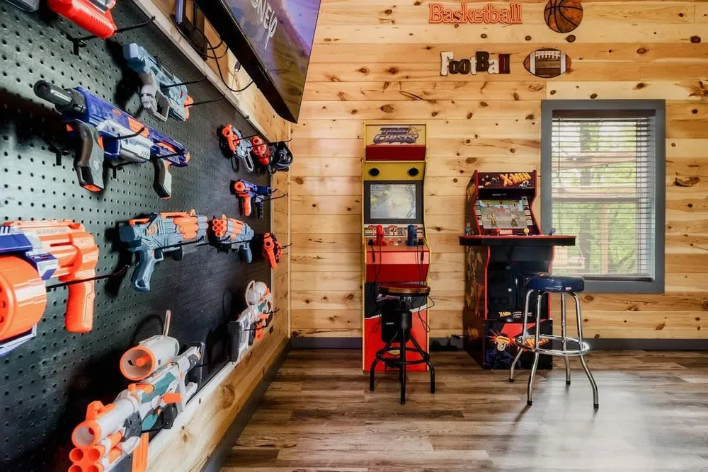 Game room with arcade and toy guns