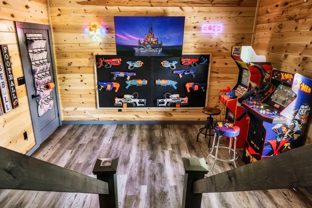 Game room with arcade and dartboard