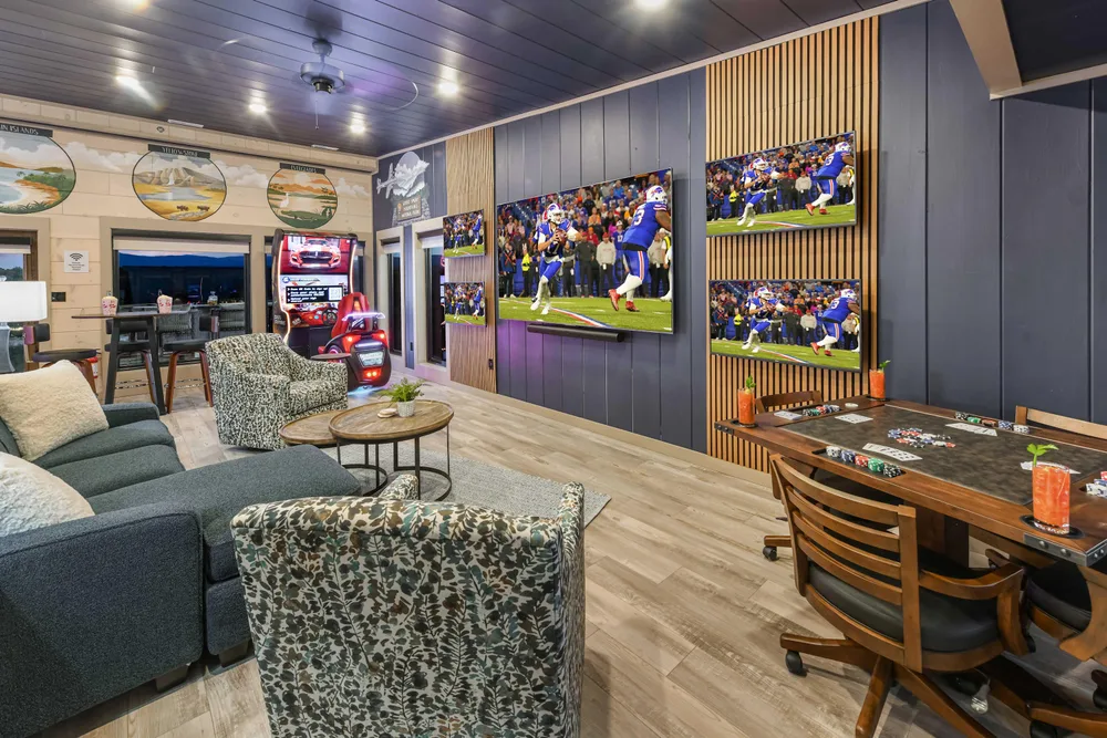 Game room with multiple large TVs