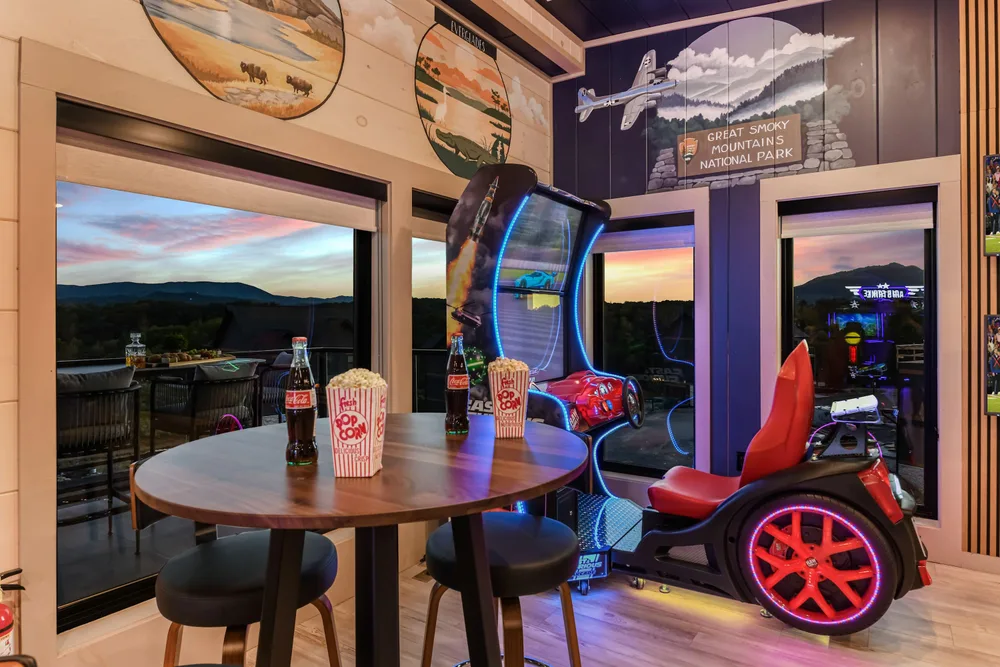 Game room with arcade and lake view