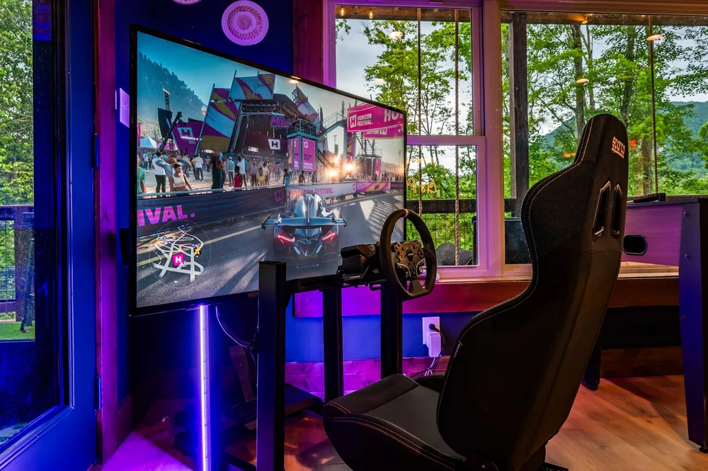 Gaming setup with large monitor and chair