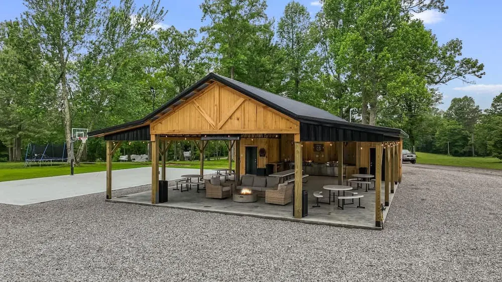Covered outdoor lounge area with fireplace