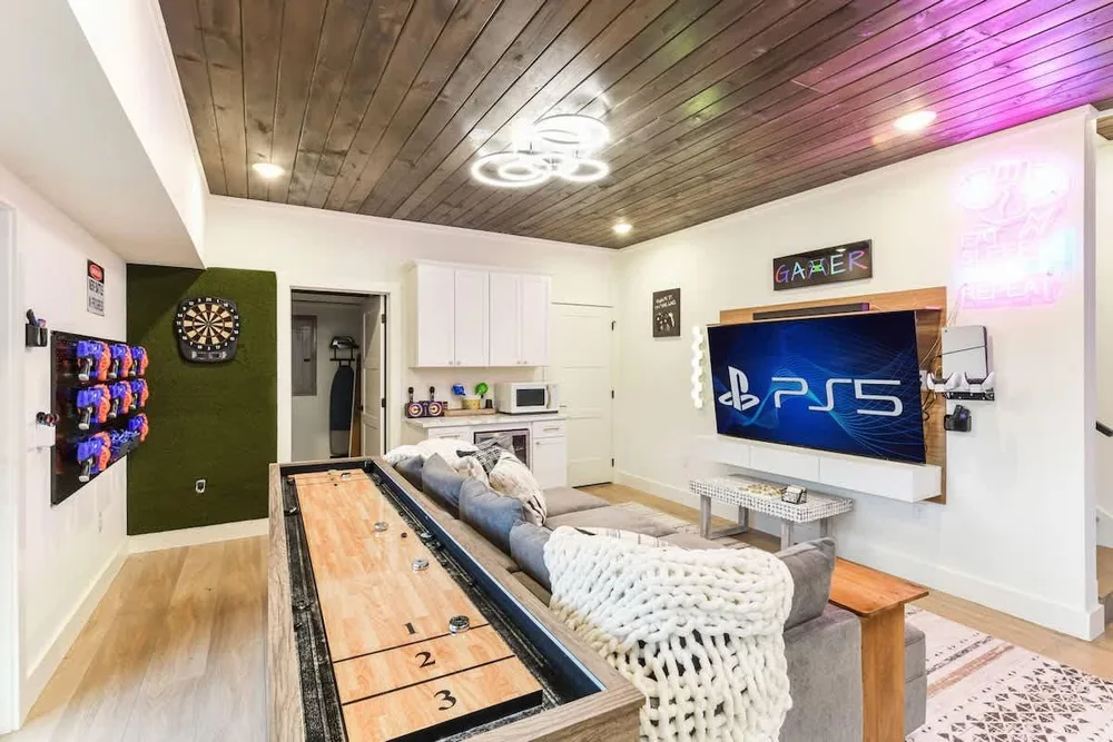 Game room with PS5 and shuffleboard